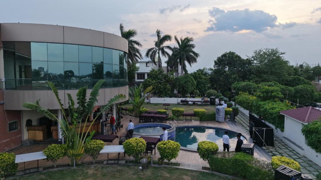 an overhead view of a building with a swimming pool at Savanna Farm in Nagpur