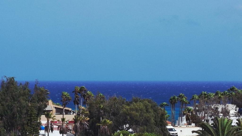 a view of the ocean from a resort at Apartamento Aliciamin in Costa Calma