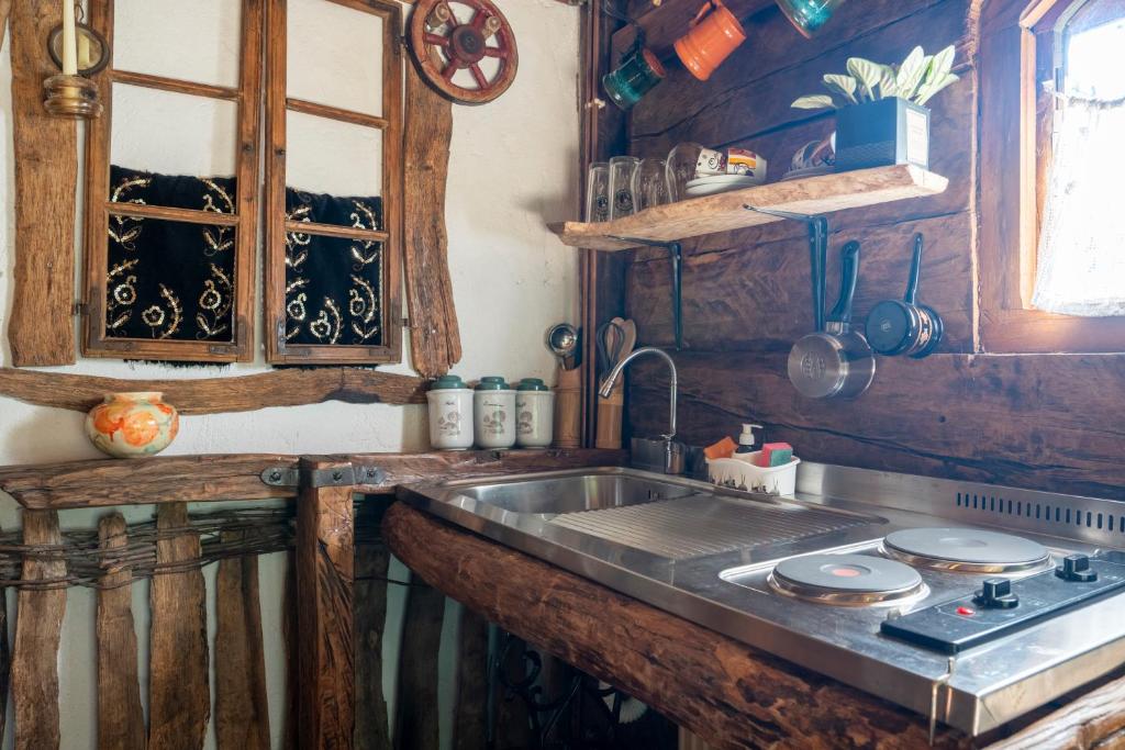 a kitchen with a sink and a counter top at Etno Kuca Bajka in Mataruška Banja