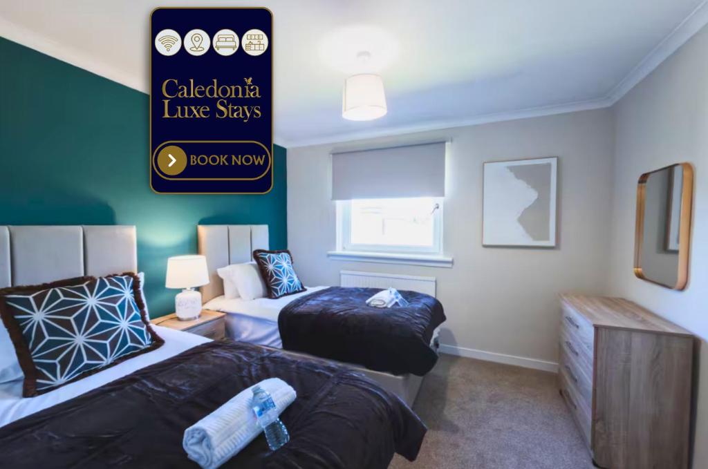 a room with two beds and a sign on the wall at The Cosy Plover in Johnstone