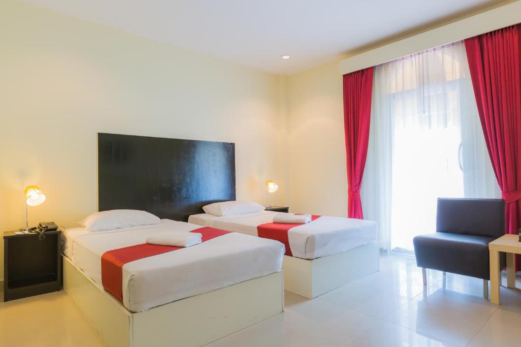 Postel nebo postele na pokoji v ubytování Zing Resort & Spa