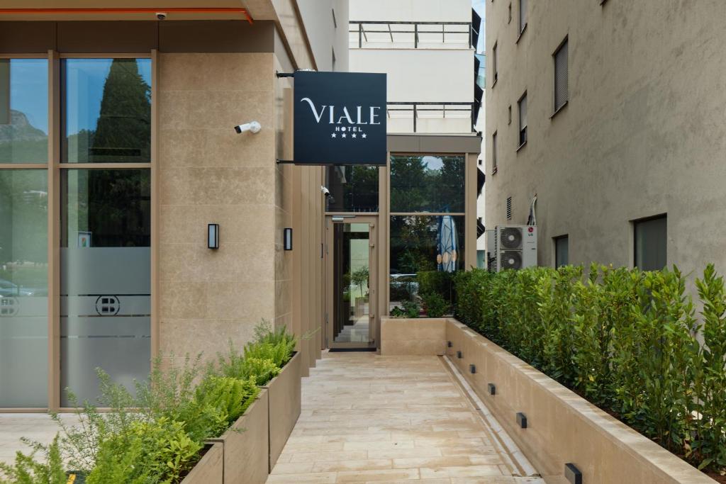 a sign for a building with a walk way at Viale in Budva
