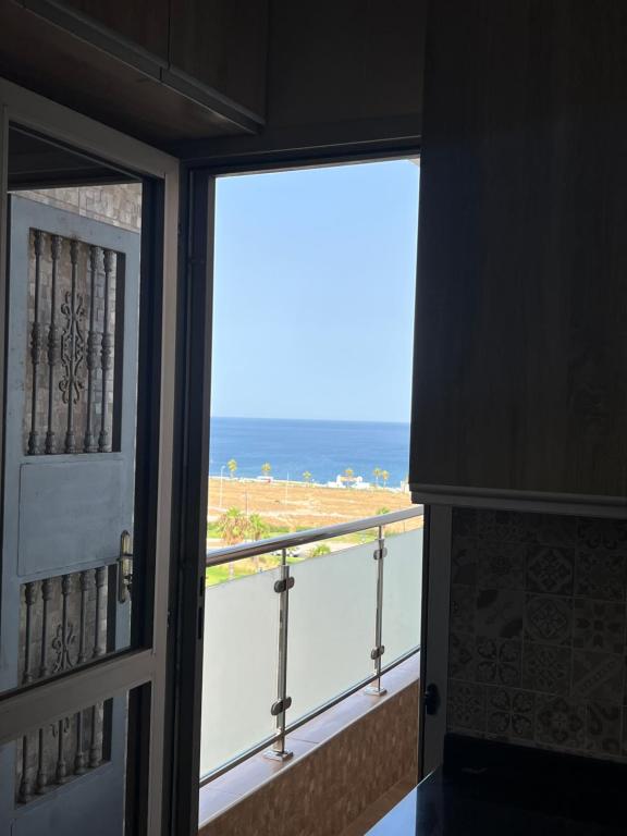 a view of the ocean from a balcony at Jad Moon Stay in Fnidek