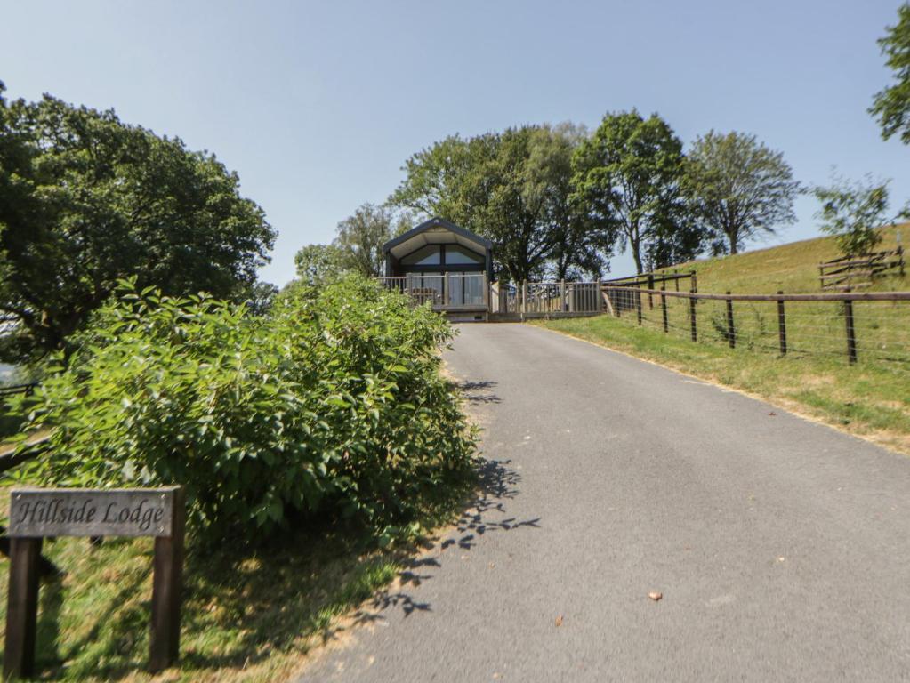 a road leading to a gazebo on a hill at Hillside Lodge in Rhayader