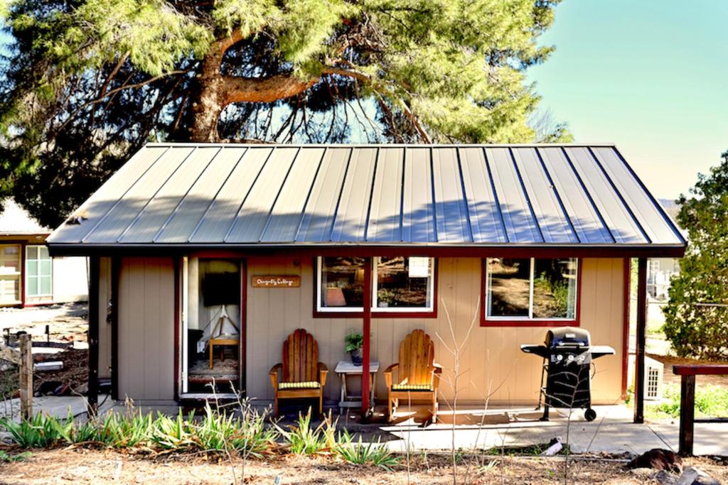 a small house with two chairs and a table at Designer King Studio Private Curated Cottage in Cottonwood