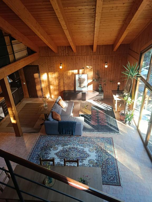 a living room with a couch and a rug at Landscape Casa de Madera in Tarragona
