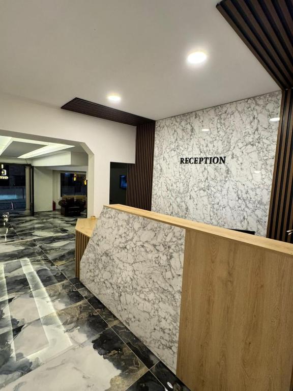a reception area of a hotel lobby with a reception counter at Ydora Luxury Hotel in Bodrum City