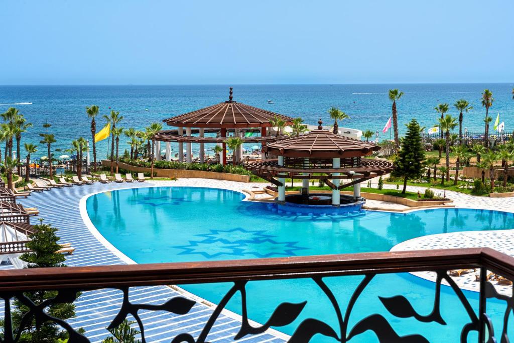 a resort with a large pool and a gazebo at Lancaster Palace Tamuda Bay in Marina Smir