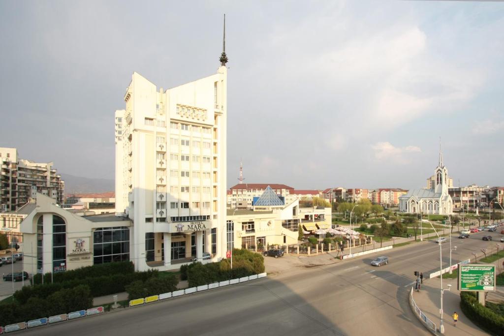 
a large building on a city street at Hotel Mara in Baia Mare

