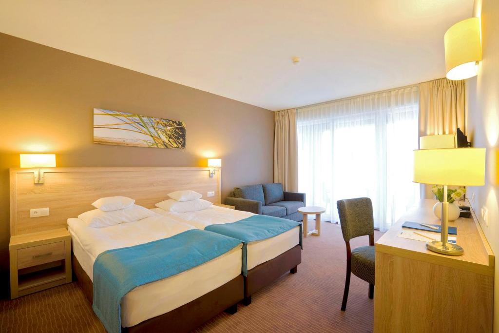 Postel nebo postele na pokoji v ubytování Tristan Hotel & SPA
