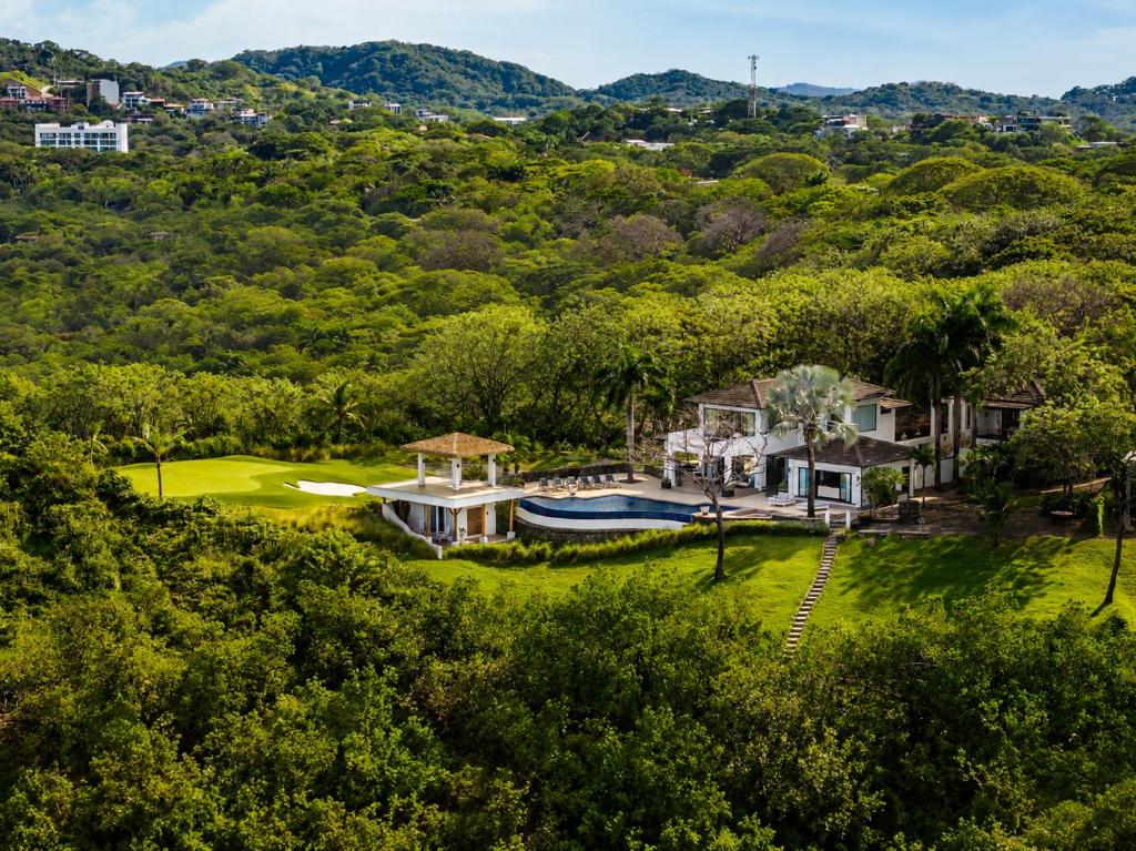 an aerial view of the house and its yard at The Point Your Private Oceanfront Resort in Tamarindo
