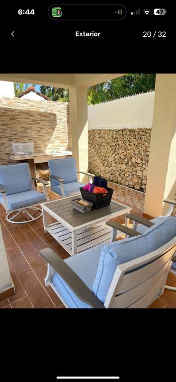 a picture of a patio with chairs and a table at Rico Puerto Village cabrera in Cabrera