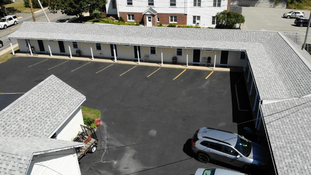 an aerial view of a building with a parking lot at Royale Coach Motor Lodge in Hampton