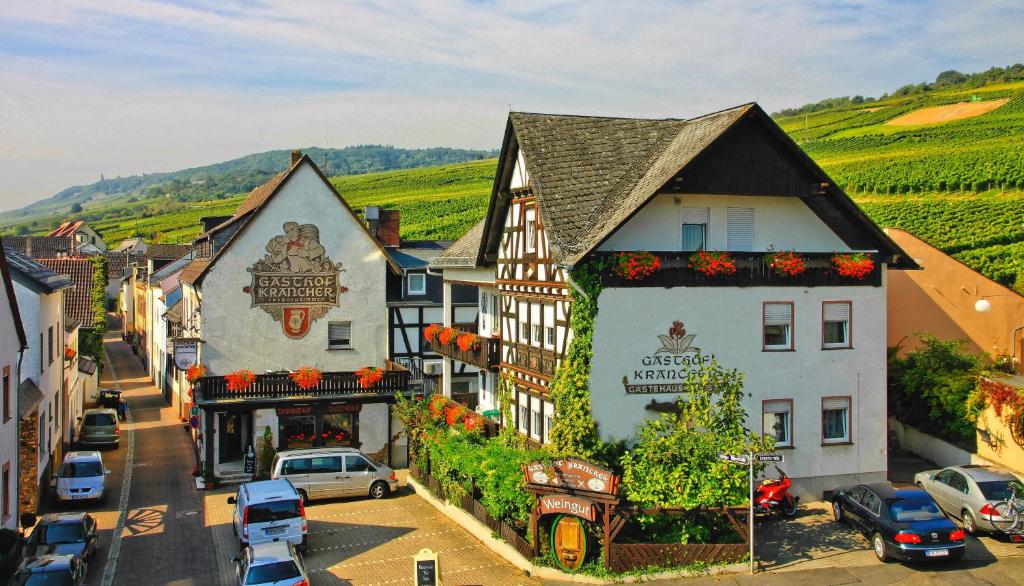 a small town with cars parked on a street at Gasthof Krancher in Rüdesheim am Rhein