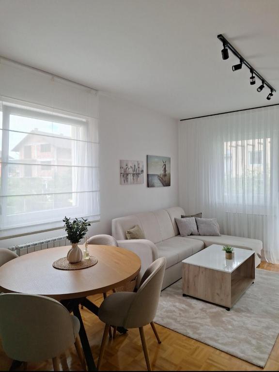 a living room with a couch and a table at The Olive Branch in Sarajevo