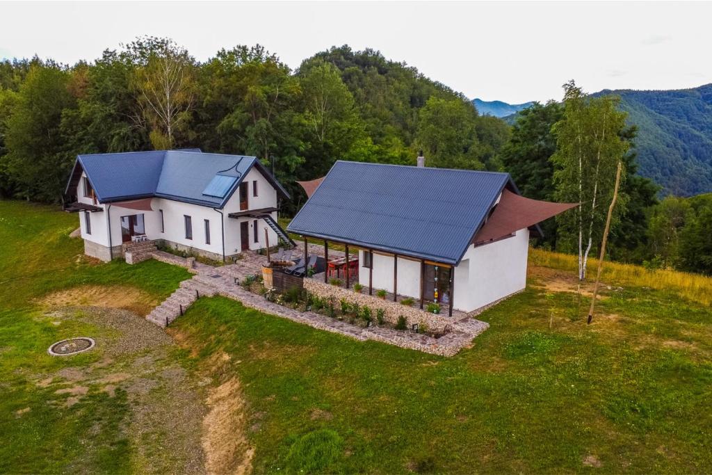 an aerial view of a house with a blue roof at K-Home in Stănija
