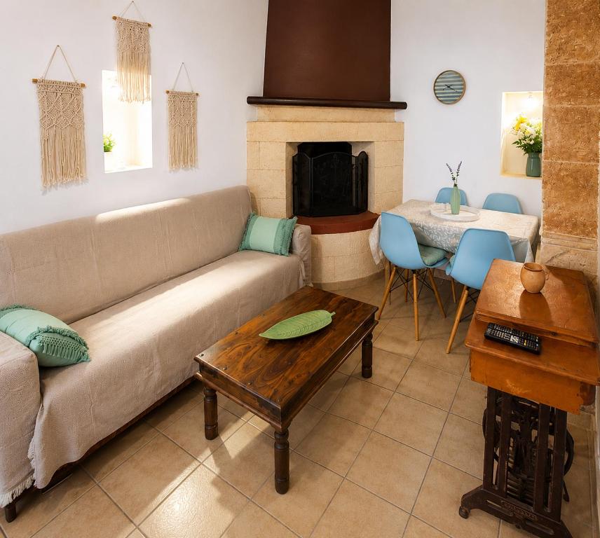 a living room with a couch and a table at Traditional House in Laerma in Láerma