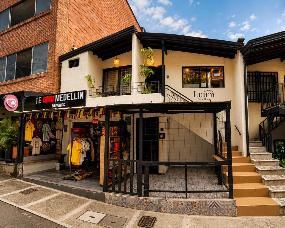a store on the corner of a street at Luum Guest House Manila in Medellín