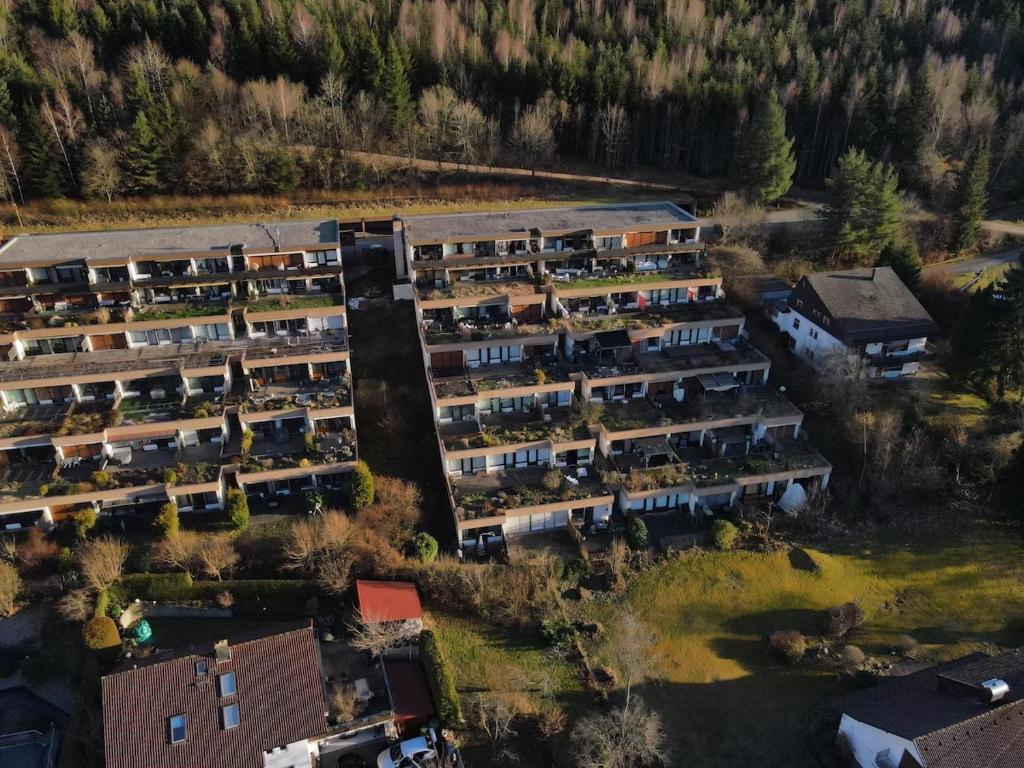 an overhead view of an apartment complex with trees at Wald Living in Baiersbronn