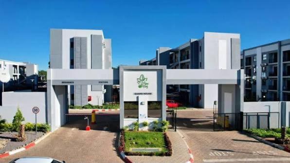 a building with a car parked in front of it at Otgreen suites in Gaborone