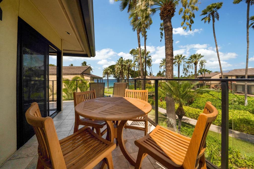 a patio with a table and chairs on a balcony at WAILEA ELUA, #1104 in Wailea