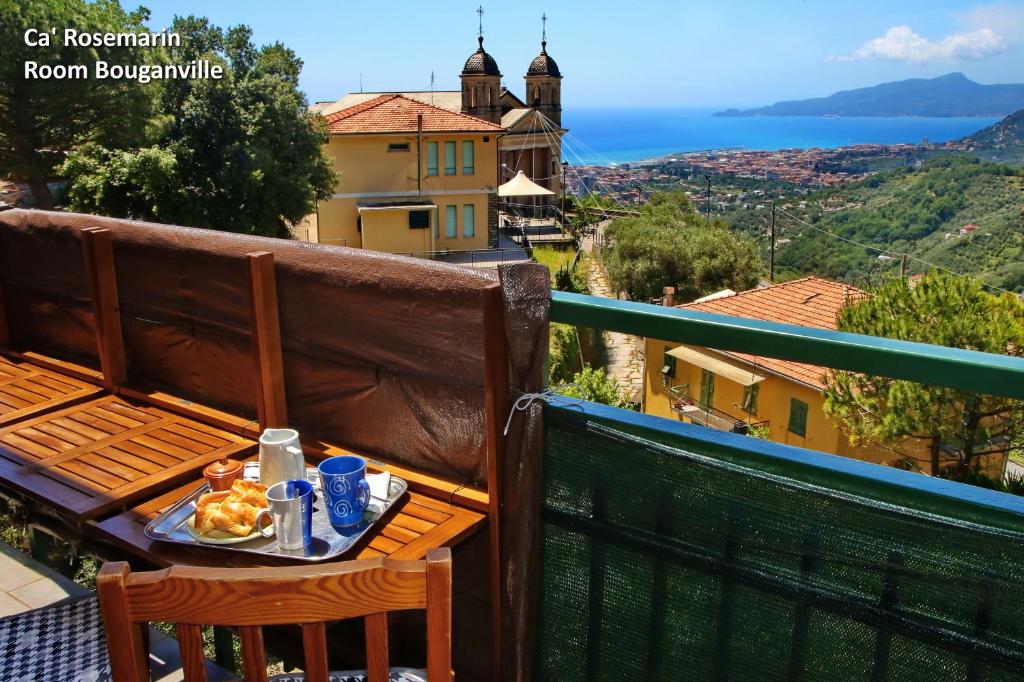 a tray of food sitting on a table on a balcony at Ca' RoseMarin in Cogorno