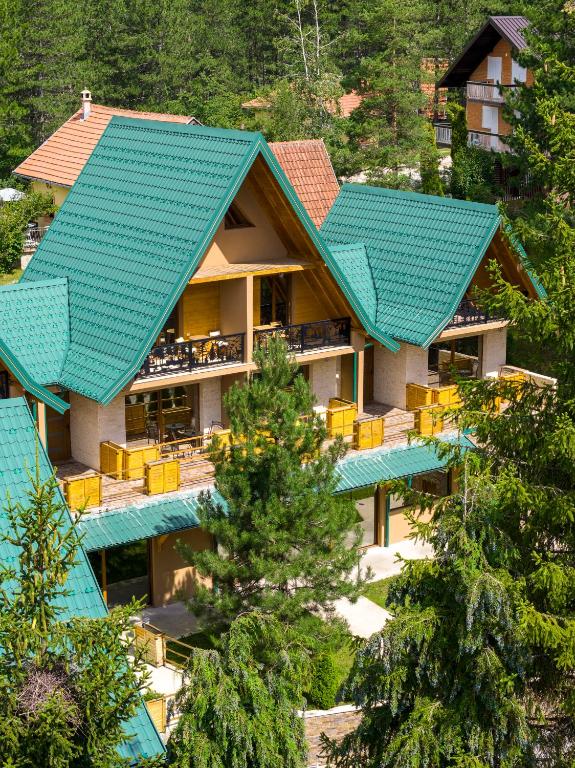 an aerial view of a resort with blue roof at Brvnara Mont 1 in Zlatibor