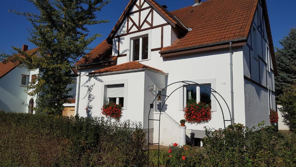 a white house with flower boxes on the door at BellaCaro in Löhne