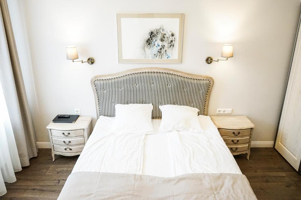 Postel nebo postele na pokoji v ubytování Guest House Senasis Pastas