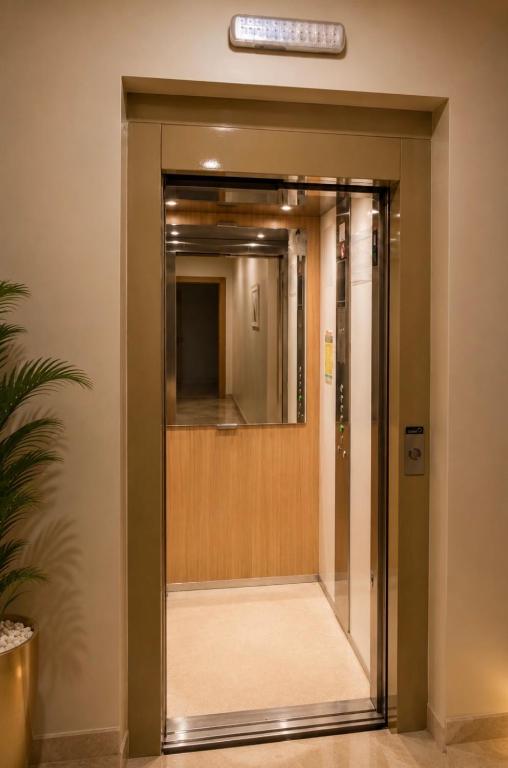 an elevator in a building with a mirror at شقة فاخرة للكراء اليومي in Casablanca
