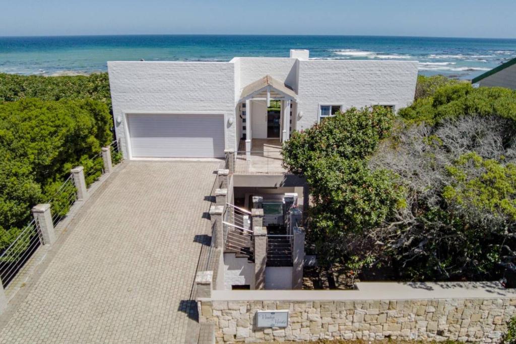 an aerial view of a house with the ocean at Vinho Verde Splendid Sea View Jacuzzi in Franskraalstrand
