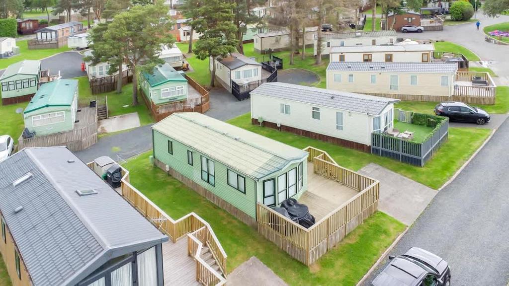 an aerial view of a village with houses and cars at The Chester-2 bed Static Caravan in Oxnam