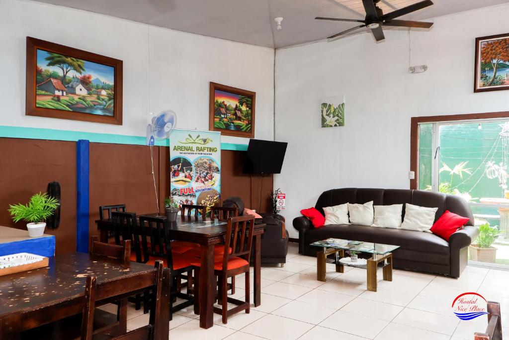 a living room with a couch and a table at Nice Place Hostel in Fortuna