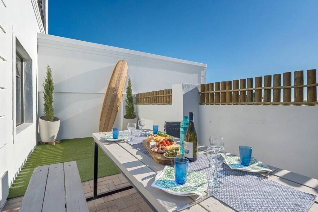 a table with a bowl of food on a patio at Coast Unit 5, Bright Escape By Langebaan Lagoon in Langebaan