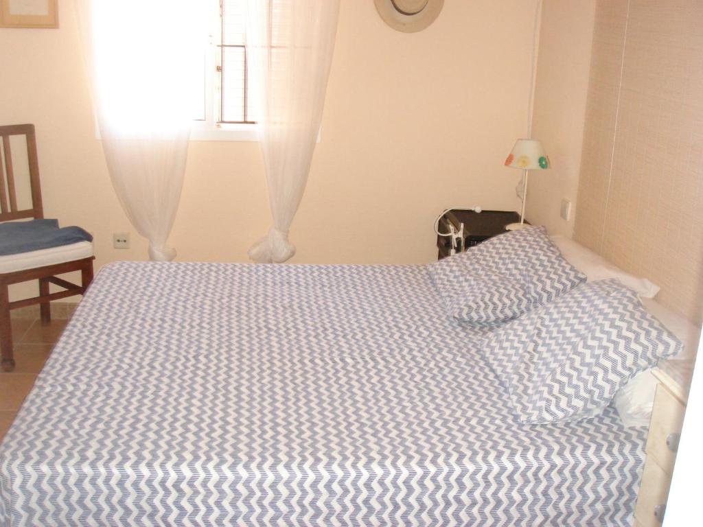 Łóżko lub łóżka w pokoju w obiekcie Chalet Pto Sta Maria, SOLO FAMILIAS