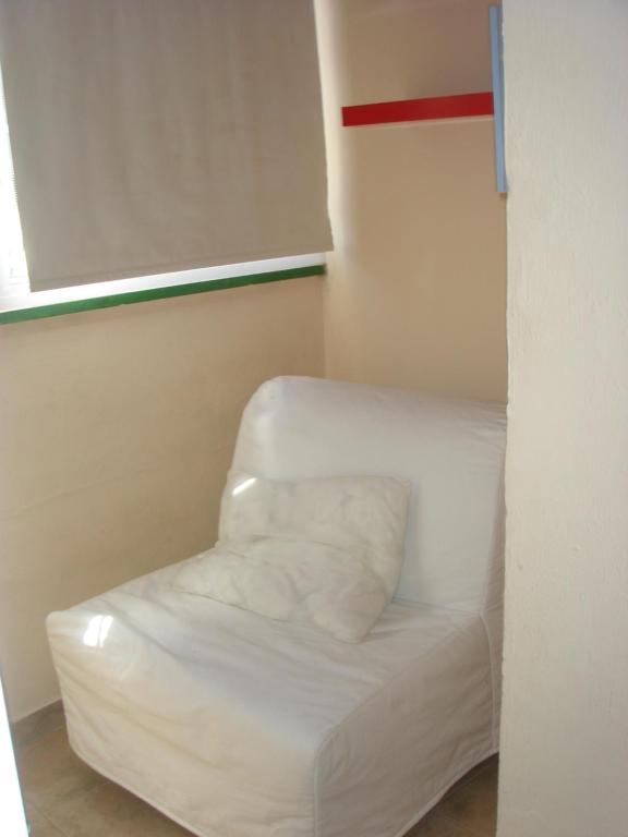 Łóżko lub łóżka w pokoju w obiekcie Chalet Pto Sta Maria, SOLO FAMILIAS