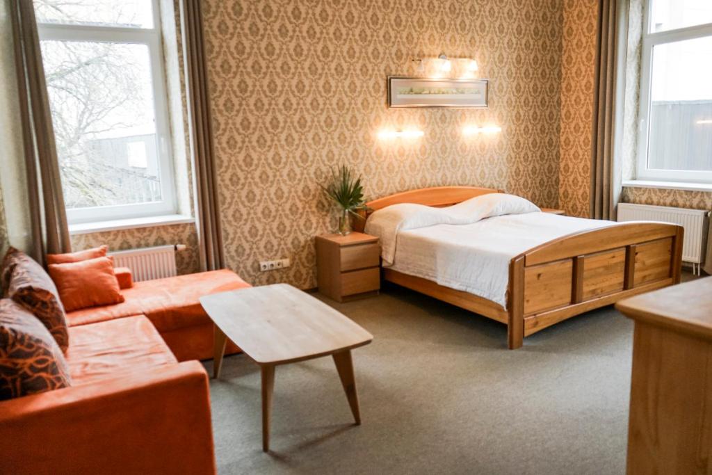 Postel nebo postele na pokoji v ubytování Guest House Senasis Pastas