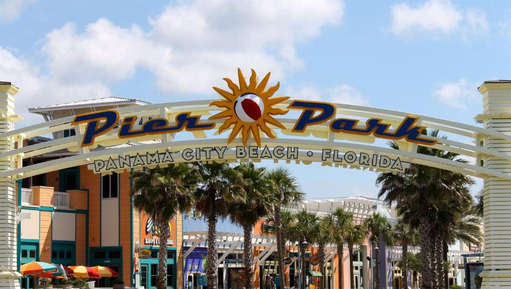 a roller coaster sign in front of a building at PierPark Cozy Condo w View Sterling Breeze Resorts in Panama City Beach