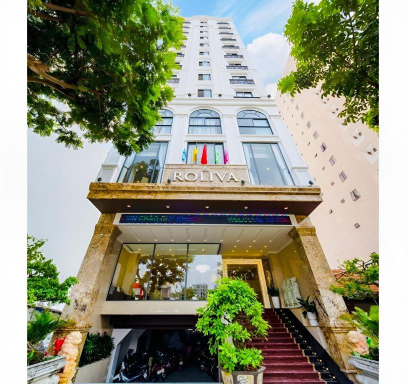 a building with a sign on the front of it at Roliva Hotel & Apartment Danang in Danang