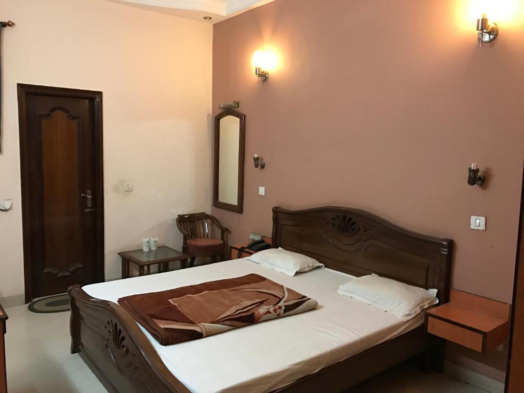 Postel nebo postele na pokoji v ubytování Hotel D R International