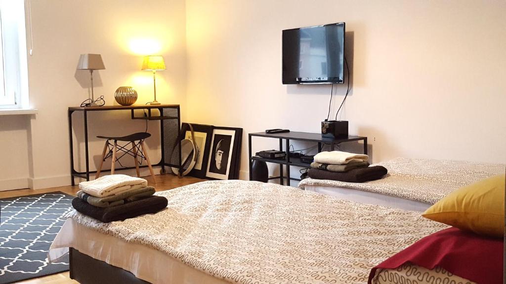 Posteľ alebo postele v izbe v ubytovaní Apartament Centrum Rynek
