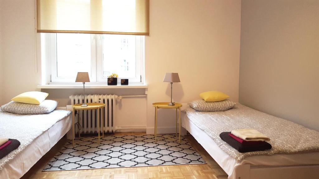Posteľ alebo postele v izbe v ubytovaní Apartament Centrum Rynek