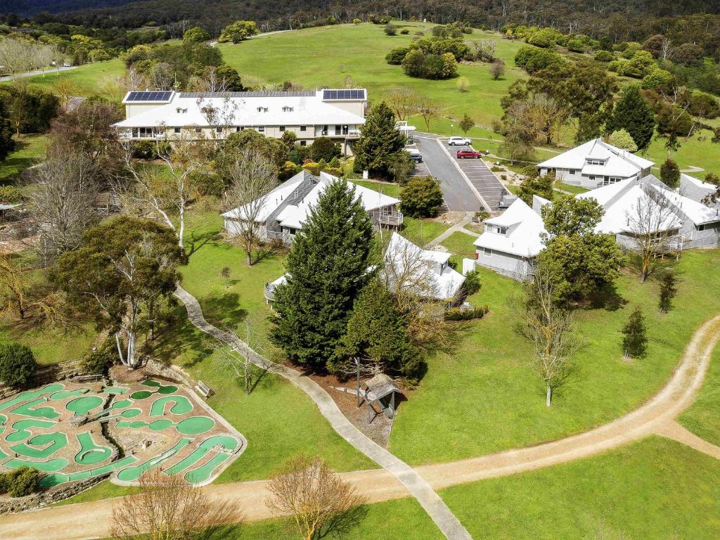 an aerial view of a resort with a golf course at The Sebel Pinnacle Valley in Merrijig