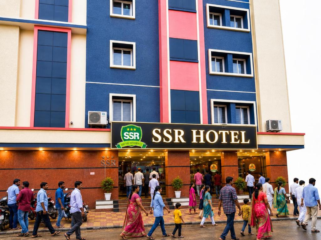 a group of people walking in front of a ssr hotel at SSR Hotel in Srikalahasti