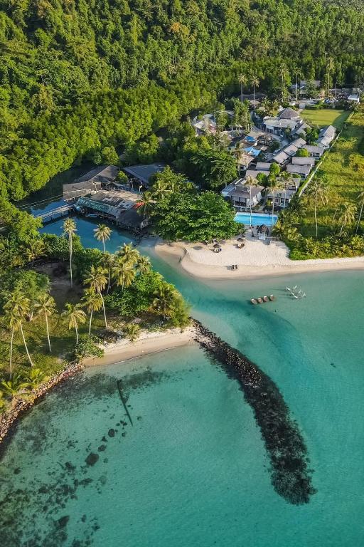 an aerial view of a beach with palm trees at Rest Sea Resort Koh Kood in Ko Kood