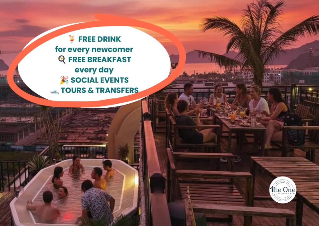 a group of people in a hot tub at a restaurant at The One Hostel & Rooftop Bar Catba in Cat Ba