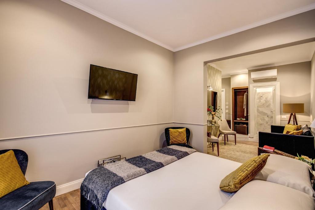 Postel nebo postele na pokoji v ubytování Charme Spagna Boutique Hotel