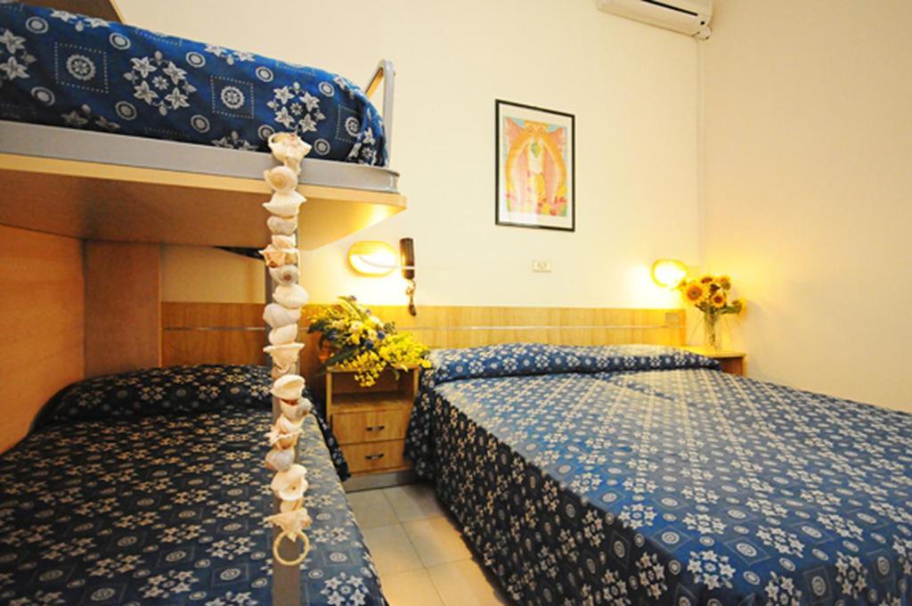 Postel nebo postele na pokoji v ubytování Hotel Marina