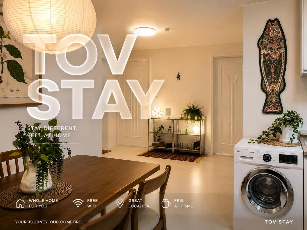 a kitchen and dining room with a view of a house at TOV stay in Seoul