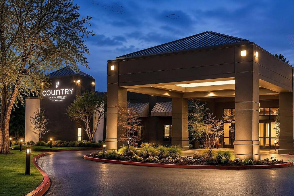 a lobby of a hotel with a building at Country Inn & Suites by Radisson, Seattle-Bothell, WA in Bothell